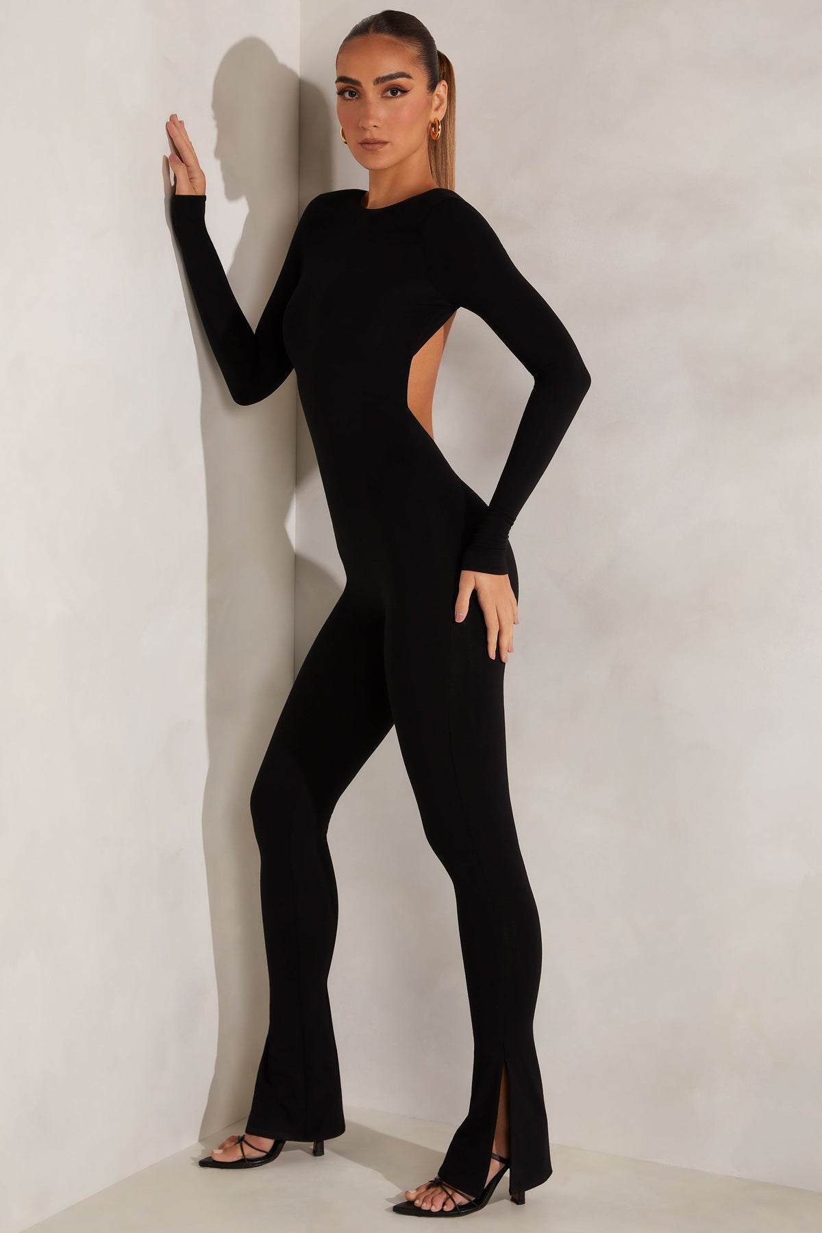 Belavie Rumar High Neck Open Back Jumpsuit in Black