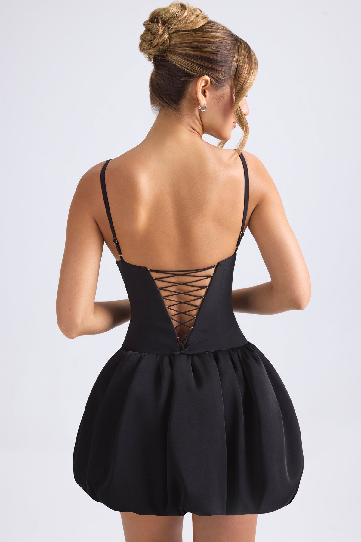 Belavie Anahite Lace-Up Bubble Hem Corset Micro Mini Dress in Black