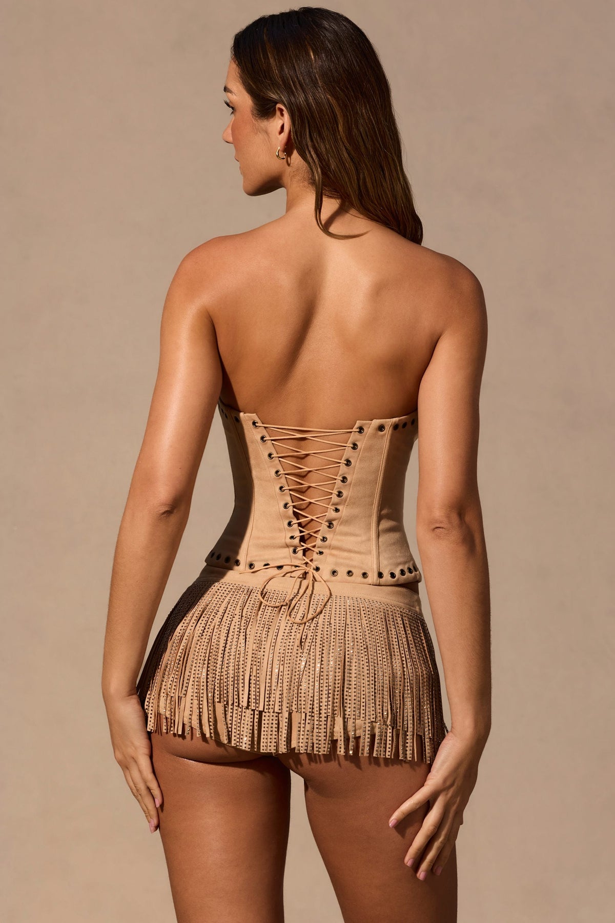 Belavie Meliore Fringed Low-Rise Mini Shorts in Tan