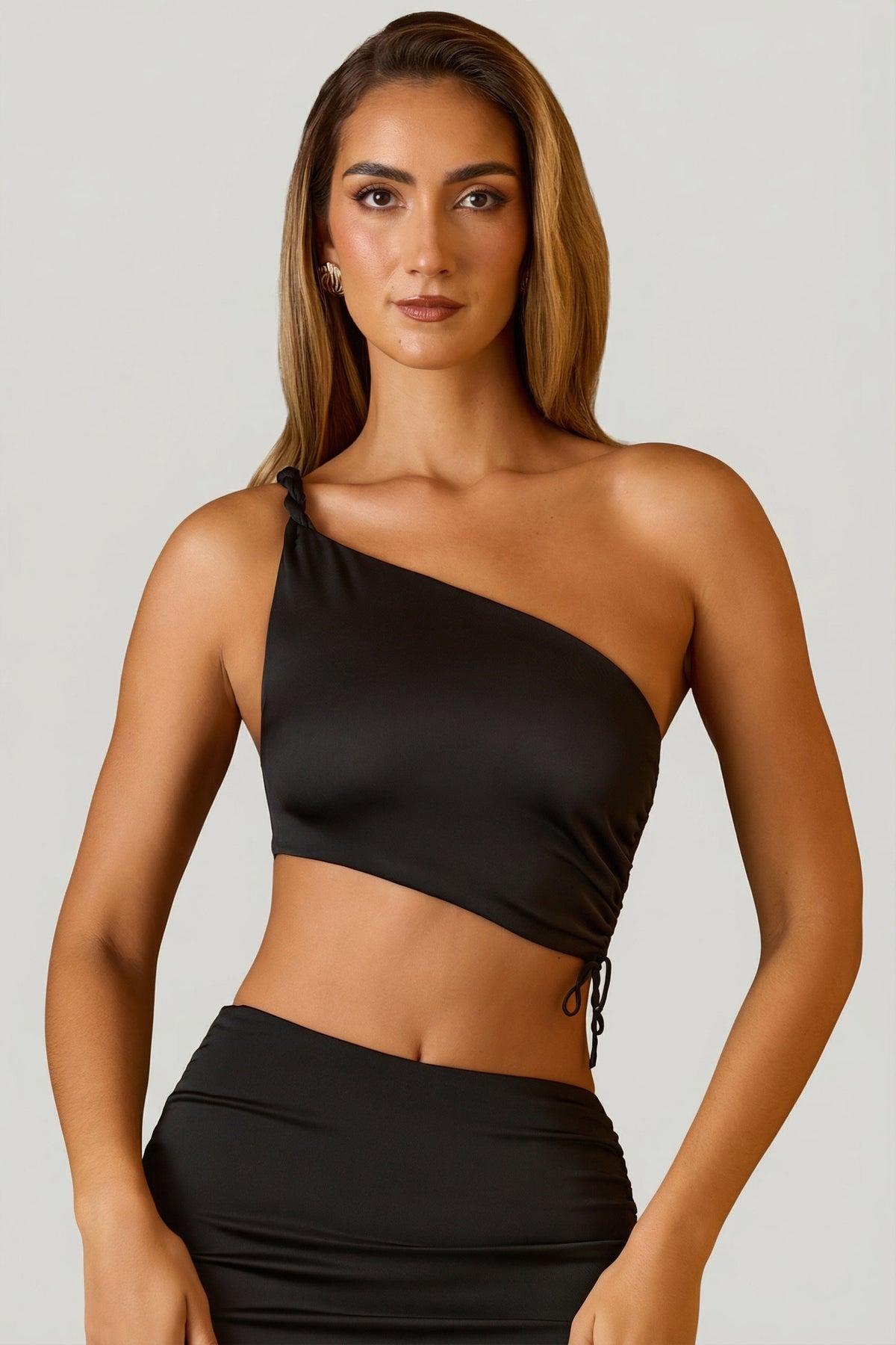 Belavie Brise Ruched Asymmetric Crop Top in Black