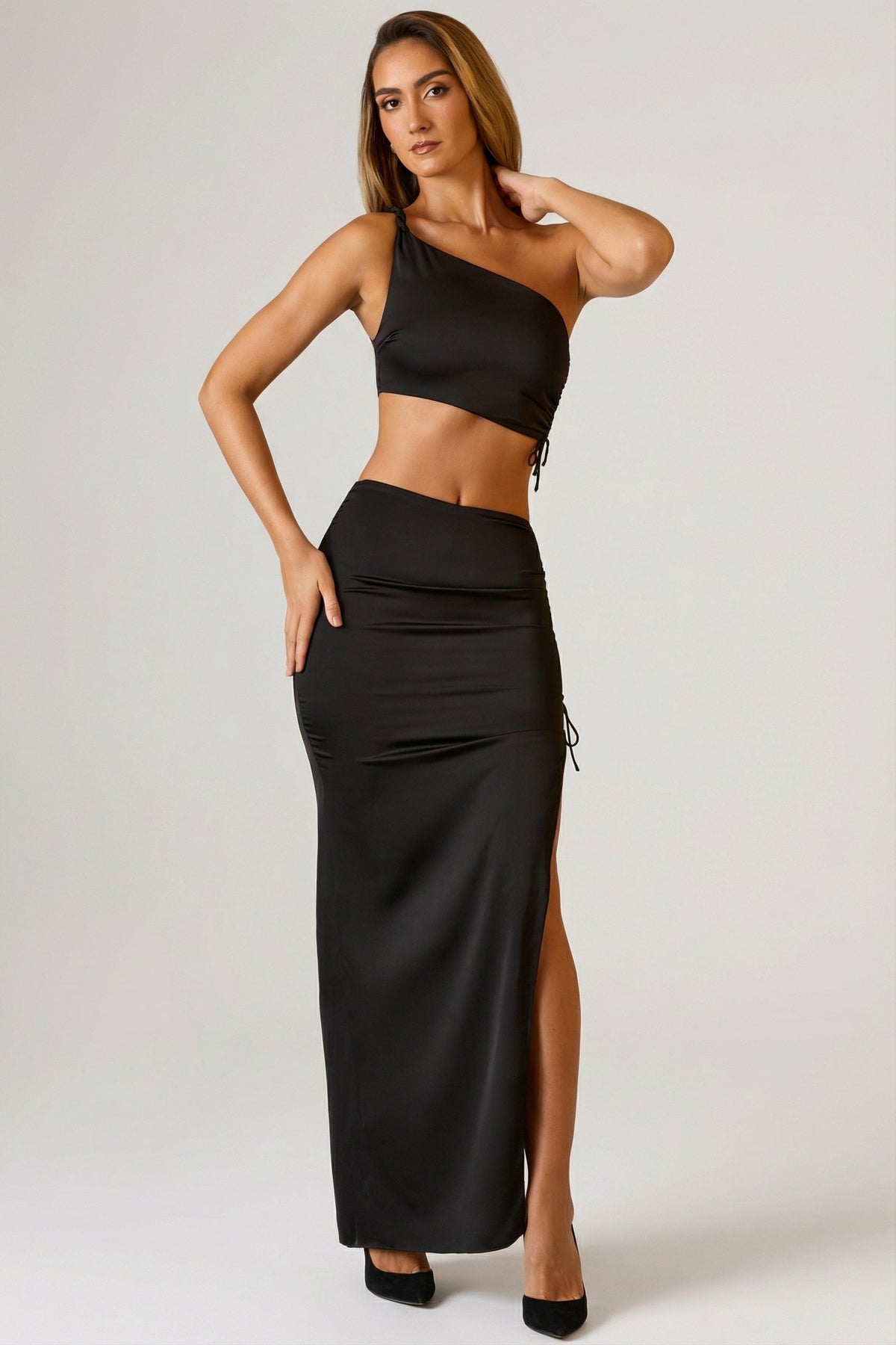 Belavie Brise Ruched Asymmetric Crop Top in Black