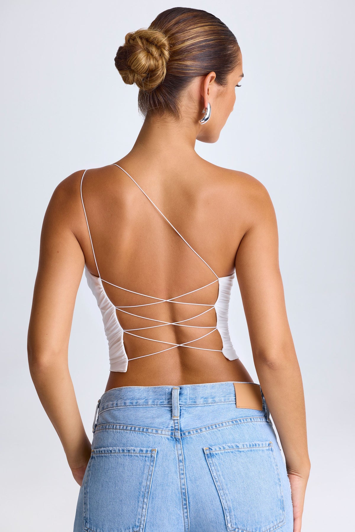 Belavie Roseao One-Shoulder Lace-Up Top in White